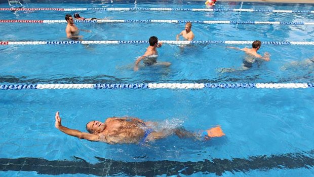 Water cure ... the Waratahs at a recovery session  at the SFS pool yesterday.