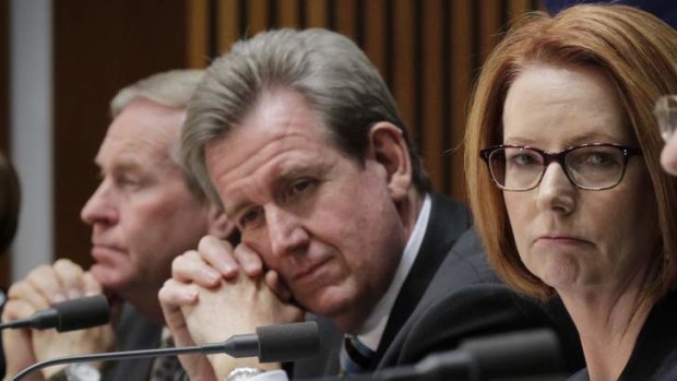 NSW Premier Barry O'Farrell (centre) has raised questions about the increased Gonski offer made by Prime Minister Julia Gillard to WA Premier Colin Barnett (left).