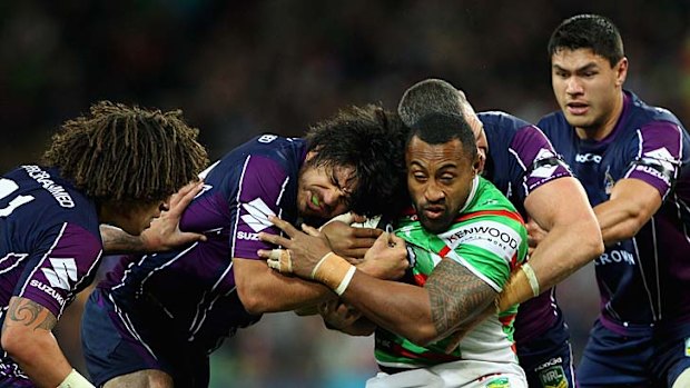 Roy Asotasi of the Rabbitohs is tackled.