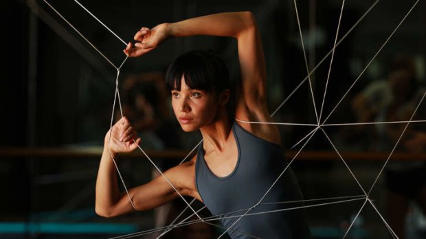Stretching the limits &#8230; dancer Charmene Yap uses a web of elastic to devise new moves.