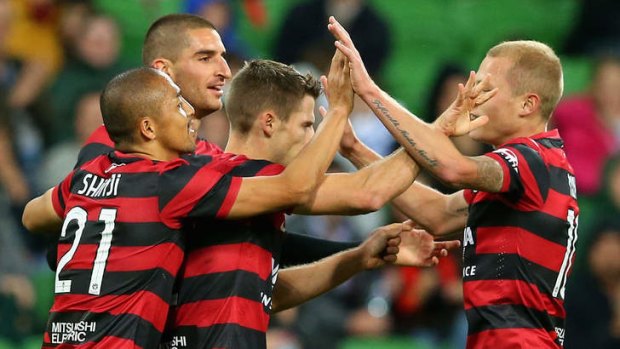 Great start: Wanderers teammates congratulate Shannon Cole on scoring against Melbourne Heart on Friday.