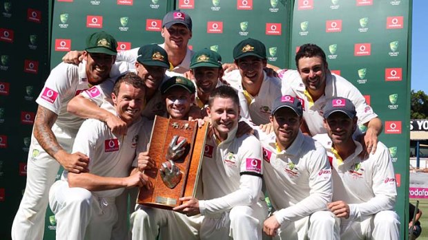 The Australian team with the series trophy.