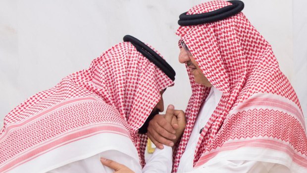 Mohammed bin Salman, when newly appointed as crown prince, left, kisses the hand of Prince Mohammed bin Nayef at royal palace in Mecca.