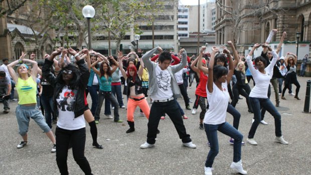 A flash mob perform a tribute to the late Michael Jackson at Sydney Square next to Town Hall.