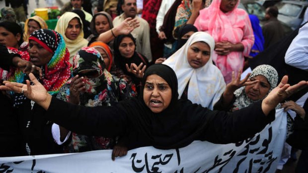 Vaccination workers protest in Karachi against the killing of their colleagues.