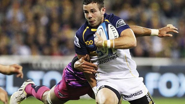 Robbie Coleman of the Brumbies is tackled.
