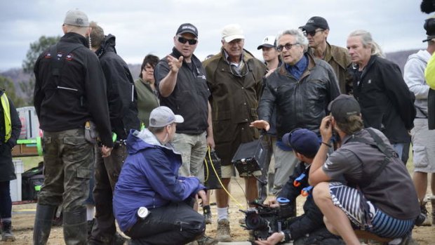 Action: George Miller and crew position cameras for some of the final shots for Mad Max.