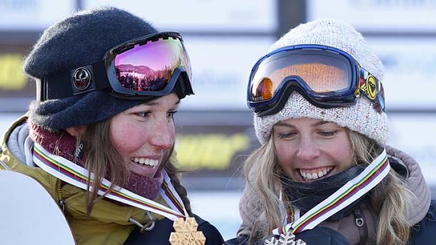 Canada's Spencer O'Brien and Australia's Torah Bright with their medals after the women's Snowboard Slopestyle Finals at the FIS Snowboard World Championships in Stoneham, Quebec.