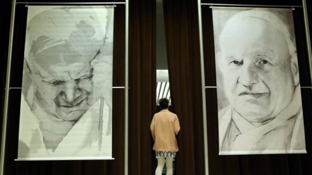 Saintly: Images of Pope John Paul II and Pope John XXIII.