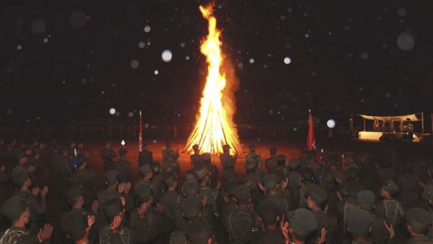 Cold War frontier: An infantry unit of the Korean People's Army gathers around a campfire during military exercises at the site of a Korean War battle.