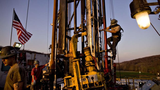 Workers attach pipes at a natural gas drill site in Bradford County, Pennsylvania.