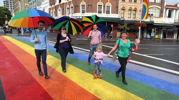 To go: (left to right) Luke Orrock, Leanne Abbott, Alex Greenwich and Megan Tordoff with daughters Tilda, 4, and Nell, 20 months, at the rainbow crossing at Oxford Street. The crossing could be removed as early as Tuesday night.