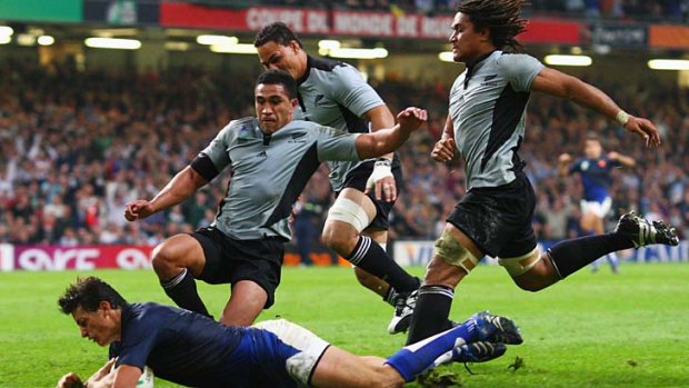 All Blacks Mils Muliaina, Chris Masoe and Rodney So'oialo arrive too late to stop Yannick Jauzion of France scoring what turned out to be the match-winning try in the 2007 World Cup quarter-final on October 6, 2007 in Cardiff.