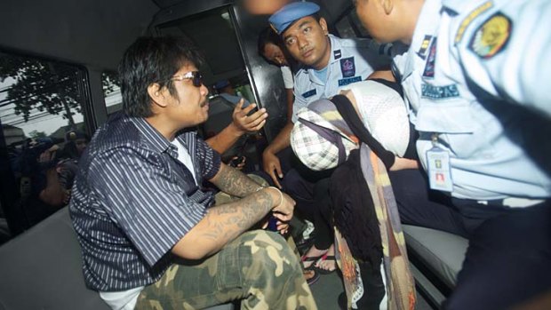 Schapelle Corby leaves Kerobokan prison in a police bus.