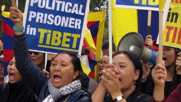 Free Tibet protesters demonstrate outside Australia's Parliament House in March.
