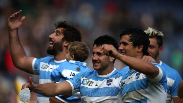 Historic: Argentinian players celebrate their team's qualification for the quarter finals. 