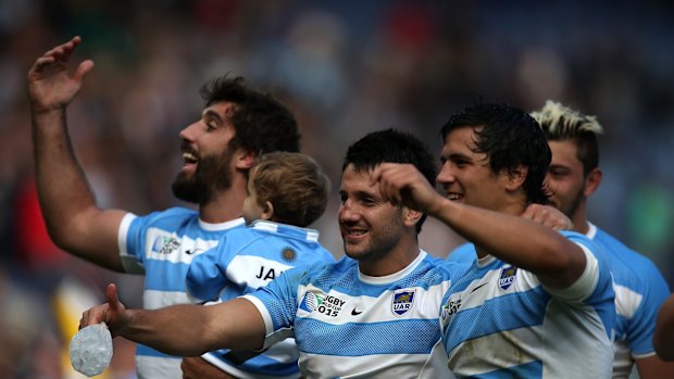 Historic: Argentinian players celebrate their team's qualification for the quarter finals. 