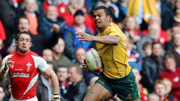Man of the match Kurtley Beale heads for the tryline.