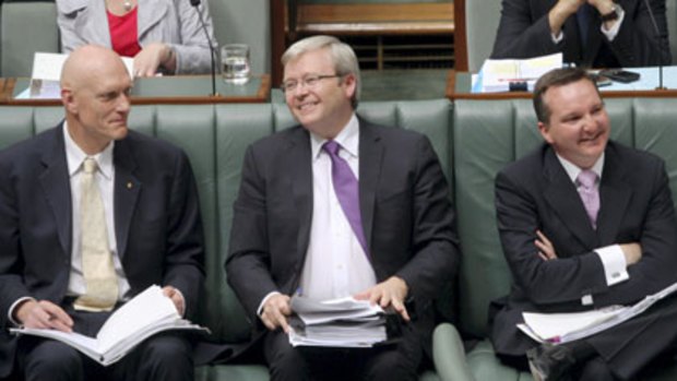 Centre of attention ... the globetrotting Foreign Minister takes his place on the frontbench for question time yesterday.
