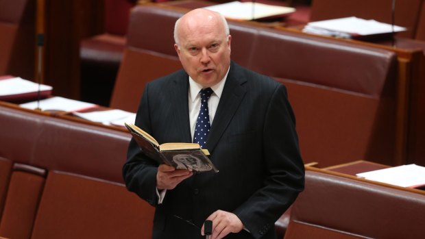 Former arts minister George Brandis reads from Isaac Isaacs by Zelman Cowen.