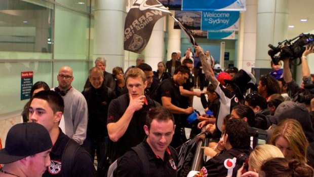 Greeting party ... the Warriors touched down in Sydney ahead of Sunday's grand final against Manly.