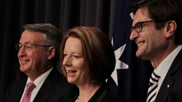 Prime Minister Julia Gillard, Deputy Prime Minister Wayne Swan and Climate Change Minister Greg Combet following the passing of the Carbon Tax bills through the Senate.