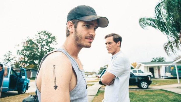 Andrew Garfield, left, and Michael Shannon  in <i>99 Homes</i>.