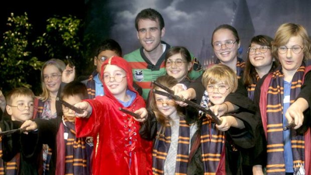 Students surround Matthew Lewis, a.k.a. Neville Longbottom at the launch for Harry Potter - The Exhibition