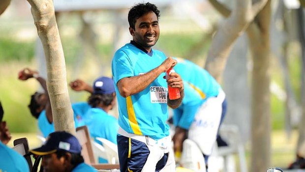 Mahela Jayawardene has a drink during a break in practice at the Dubai Sports City on Monday. The second Test against Pakistan begins on Wednesday.