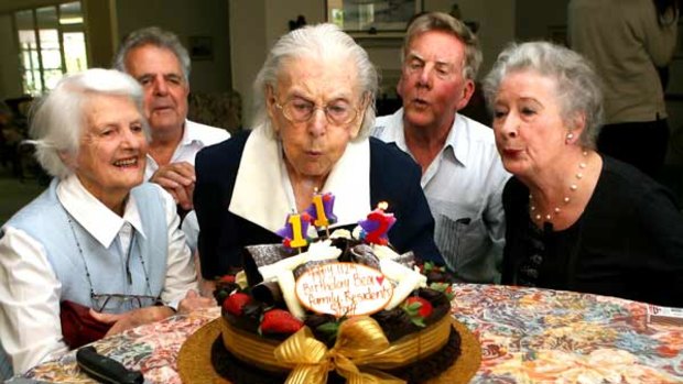 Piece of cake: Bea Riley, (centre) celebrates her 112th birthday with (left to right) her niece Bid Riley, nursing home manager Andreas Kazacos, son Cliff Riley and his wife Jueno.