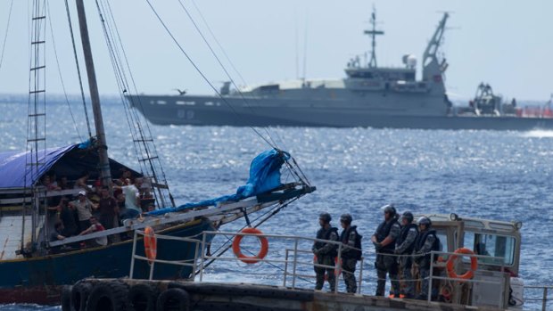 The boatload of asylum seekers was intercepted 12 nautical miles off Christmas Island.