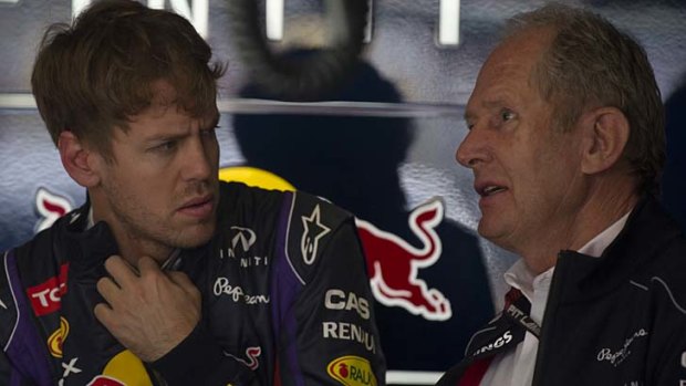 Sebastian Vettel talks to Red Bull team adviser Helmut Marko.