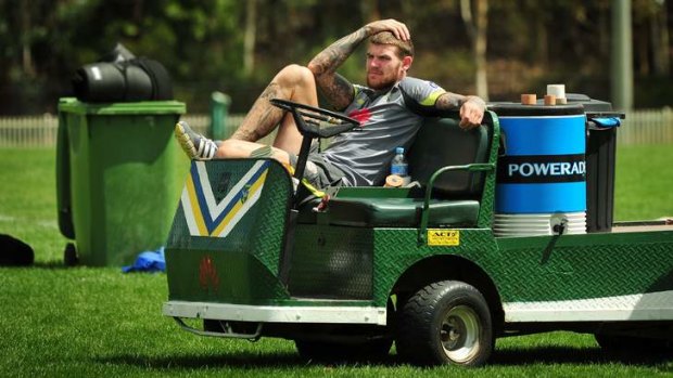 Josh Dugan watches training from the cart on Monday.