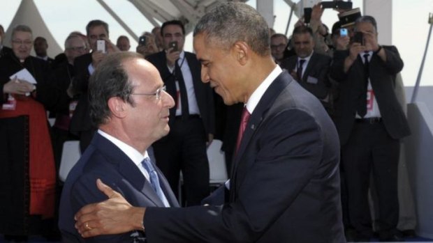 United: French President Francois Hollande greets US President Barack Obama during the D-Day commemoration ceremony on the beach of Ouistreham, Normandy.