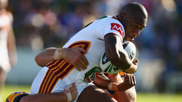 You keep me hanging on: Akuila Uate, playing for Country, is tackled.