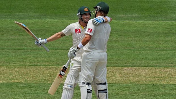 Thanks, mate &#8230; Shane Watson congratulates Michael Clarke on his century, which capped a remarkable year.