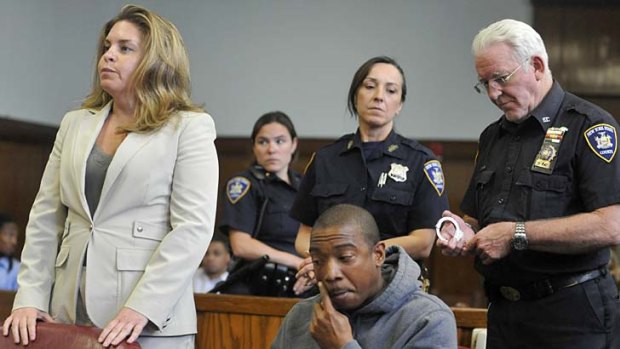 Rapper Ja Rule sits in Manhattan Supreme Court where he received a two-year jail sentence.