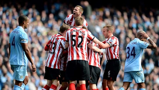 Opener: Sunderland players celebrate their first goal against Manchester City.