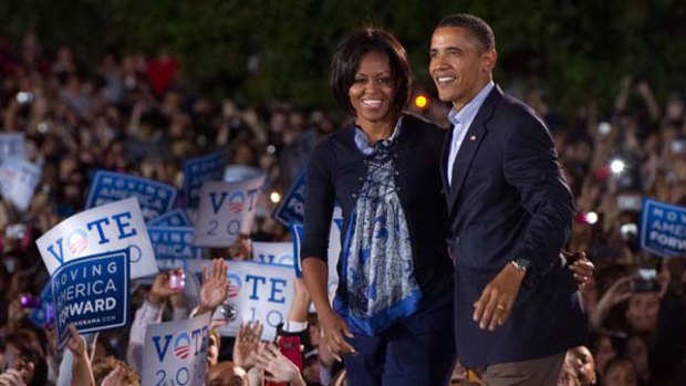 Preparing for a tough road ahead ... Michelle and Barack Obama make their first joint campaign appearance since 2008 at Ohio State University in Columbus.