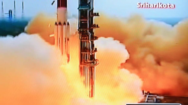 Long way to go: A television grab from Indian channel NDTV of the PSLV-C25 launch vehicle carrying the Mars Orbiter probe as its payload lifts off from the launch pad in Sriharikota.