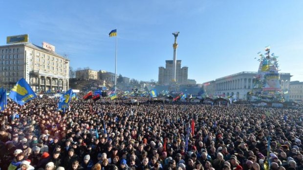 People gather during a rally of the opposition on Independence Square in Kiev.