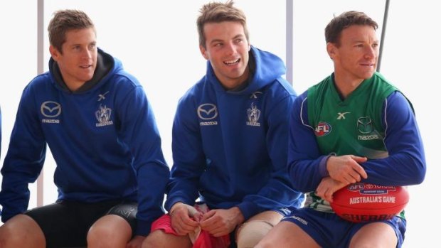 Brent Harvey (right) with Nick Dal Santo and Luke McDonald during a North Melbourne training session on Monday.
