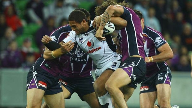 Unleash the best &#8230; Warriors winger Manu Vatuvei drags a host of Storm defenders with him during his side's win over Melbourne at AAMI Park last night.