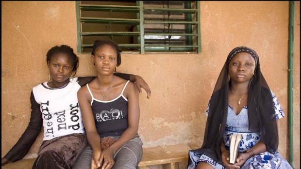 Rescued ... Magali, 15, and Shakira, 19, seated with Patience, were trafficked from Nigeria.