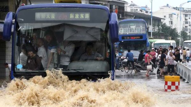 A bus moves through floodwaters in downtown Guilin in south China's Guangxi Zhuang Autonomous Region.