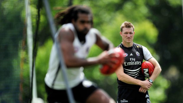 Nathan Buckley watches Harry O'Brien during the coach's first training session with the senior players at Gosch's Paddock.