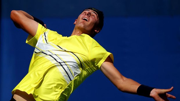 Debut win ... Bernard Tomic serves against Michael Yani in the first round of the US Open.