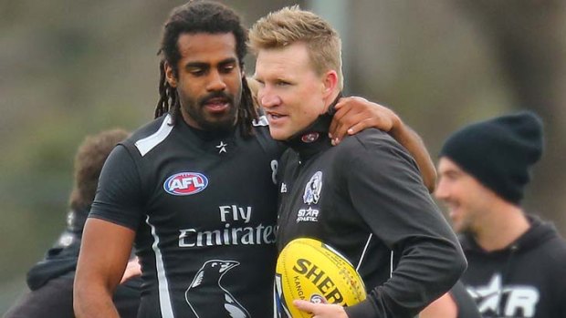 Harry O'Brien with Magpies coach Nathan Buckley at training.