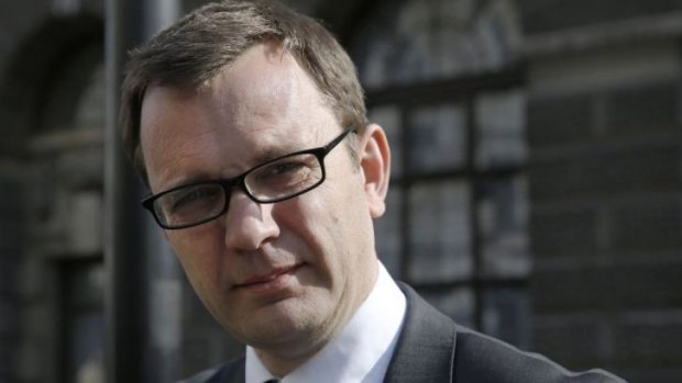 Former editor of the <i>News of the World</i> Andy Coulson leaves the Old Bailey courthouse in London.