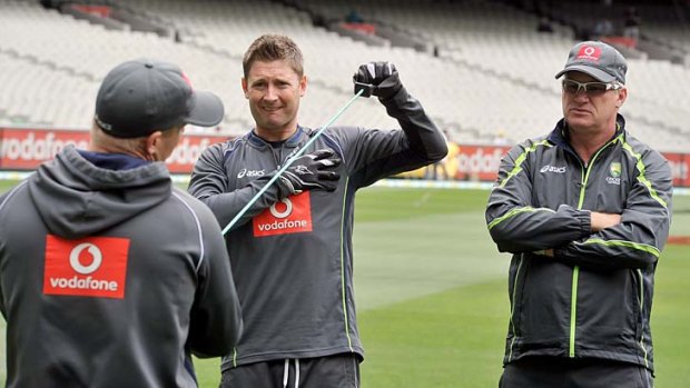 Dean Jones (right) looks on as Michael Clarke exercises during the second Test against Sri Lanka last year.
